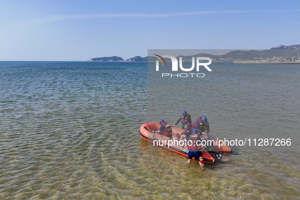 Rescuers are conducting a training to rescue drowning at sea in Yantai, China, on May 29, 2024. 