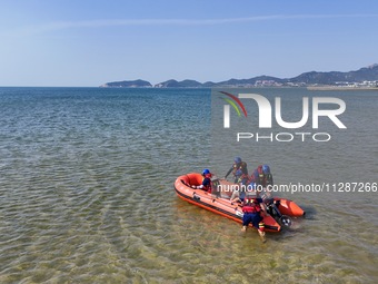 Rescuers are conducting a training to rescue drowning at sea in Yantai, China, on May 29, 2024. (