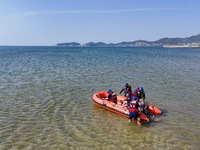 Rescuers are conducting a training to rescue drowning at sea in Yantai, China, on May 29, 2024. (