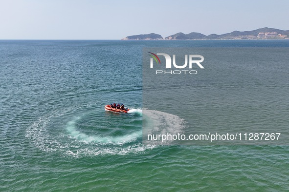 Rescuers are conducting a training to rescue drowning at sea in Yantai, China, on May 29, 2024. 