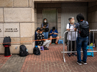 People are waiting outside the courthouse to hear the verdict of the trial of the 47 pro-democracy figures in Hong Kong, on May 30, 2024. Th...