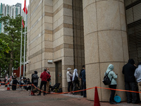 People are waiting outside the courthouse to hear the verdict of the trial of the 47 pro-democracy figures in Hong Kong, on May 30, 2024. Th...