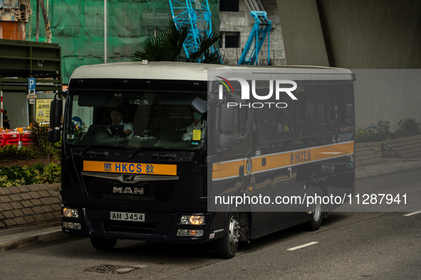 A correction service department vehicle is arriving at the courthouse where the verdict of the trial of the 47 Pro-democracy figures is bein...