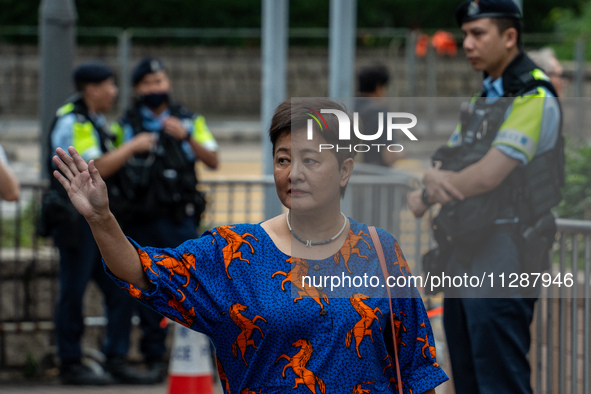 Wong Bik-Wan, one of the defendants in this case, is arriving at the courthouse where the verdict of the trial of the 47 pro-democracy figur...