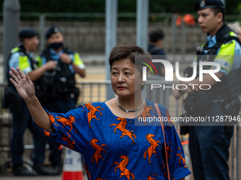 Wong Bik-Wan, one of the defendants in this case, is arriving at the courthouse where the verdict of the trial of the 47 pro-democracy figur...