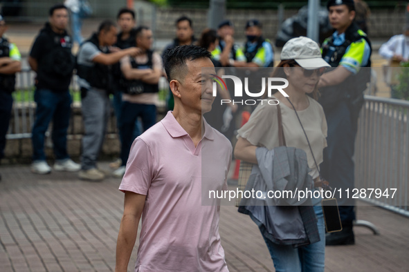 Raymond Chan Chi-chuen, one of the defendants in this case, is arriving at the courthouse where the verdict of the trial of the 47 pro-democ...