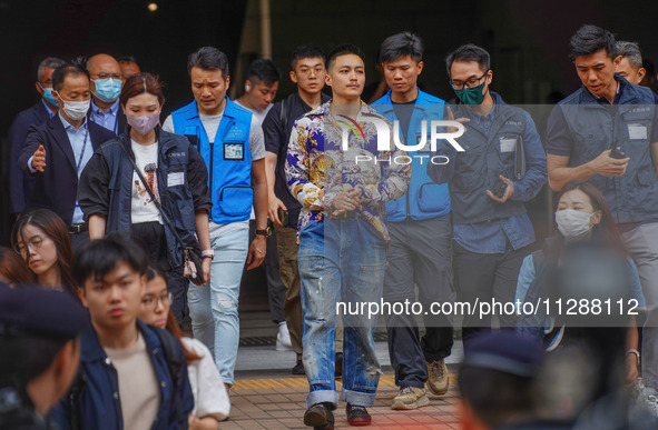 Lee Yue-shun (centre) is leaving the court building after being acquitted, in Hong Kong, China, on May 30, 2024. 