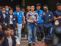 Lee Yue-shun (centre) is leaving the court building after being acquitted, in Hong Kong, China, on May 30, 2024. (