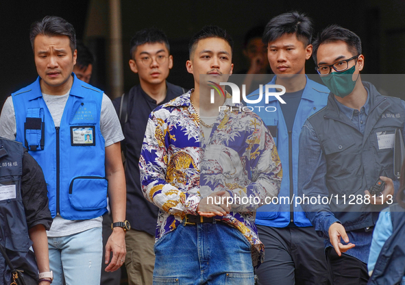 Lee Yue-shun (centre) is leaving the court building after being acquitted, in Hong Kong, China, on May 30, 2024. 