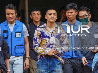 Lee Yue-shun (centre) is leaving the court building after being acquitted, in Hong Kong, China, on May 30, 2024. (