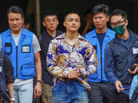 Lee Yue-shun (centre) is leaving the court building after being acquitted, in Hong Kong, China, on May 30, 2024. (