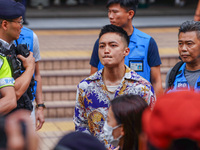 Lee Yue-shun (centre) is leaving the court building after being acquitted, in Hong Kong, China, on May 30, 2024. (