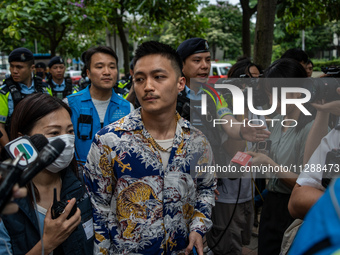 Lee Yue-shun is leaving the courthouse where the verdict of the trial of the 47 Pro-democracy figures is being handed out in Hong Kong, Chin...