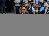 Lawrence Lau Wai-chung, one of the defendants who was acquitted in this case, is leaving the courthouse where the verdict of the trial of th...