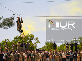 Military training exercises during the graduation ceremony of the Major General Mohammed Al-Faris course in Afrin countryside, northwest Syr...