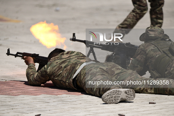 Military training exercises during the graduation ceremony of the Major General Mohammed Al-Faris course in Afrin countryside, northwest Syr...