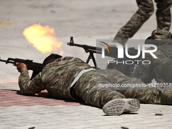 Military training exercises during the graduation ceremony of the Major General Mohammed Al-Faris course in Afrin countryside, northwest Syr...