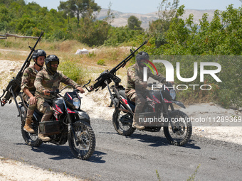 Military training exercises during the graduation ceremony of the Major General Mohammed Al-Faris course in Afrin countryside, northwest Syr...