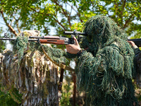 Military training exercises during the graduation ceremony of the Major General Mohammed Al-Faris course in Afrin countryside, northwest Syr...