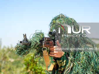 Military training exercises during the graduation ceremony of the Major General Mohammed Al-Faris course in Afrin countryside, northwest Syr...