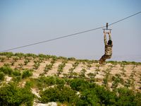 Military training exercises during the graduation ceremony of the Major General Mohammed Al-Faris course in Afrin countryside, northwest Syr...