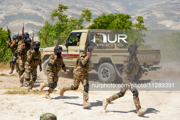 Military training exercises during the graduation ceremony of the Major General Mohammed Al-Faris course in Afrin countryside, northwest Syr...