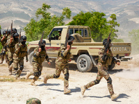 Military training exercises during the graduation ceremony of the Major General Mohammed Al-Faris course in Afrin countryside, northwest Syr...