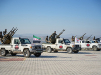 Military training exercises during the graduation ceremony of the Major General Mohammed Al-Faris course in Afrin countryside, northwest Syr...