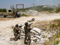 Military training exercises during the graduation ceremony of the Major General Mohammed Al-Faris course in Afrin countryside, northwest Syr...