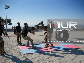 Military training exercises during the graduation ceremony of the Major General Mohammed Al-Faris course in Afrin countryside, northwest Syr...