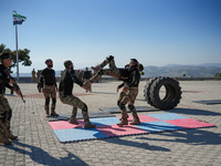 Military training exercises during the graduation ceremony of the Major General Mohammed Al-Faris course in Afrin countryside, northwest Syr...