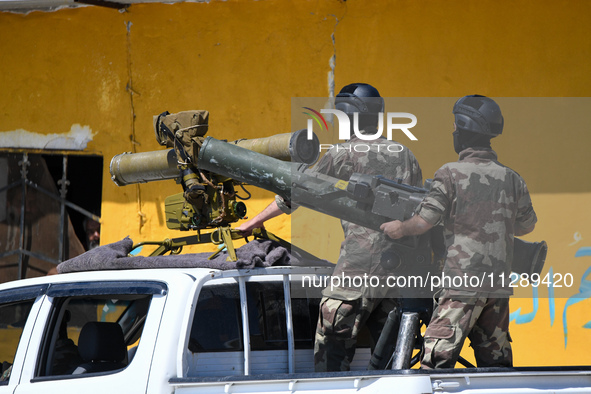 Military training exercises during the graduation ceremony of the Major General Mohammed Al-Faris course in Afrin countryside, northwest Syr...