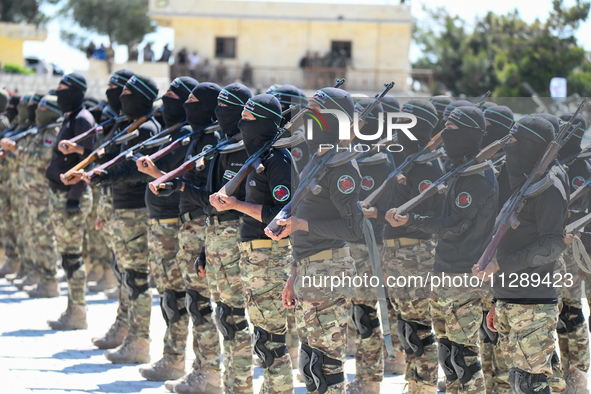 Military training exercises during the graduation ceremony of the Major General Mohammed Al-Faris course in Afrin countryside, northwest Syr...