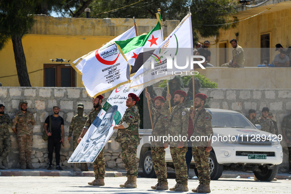 Military training exercises during the graduation ceremony of the Major General Mohammed Al-Faris course in Afrin countryside, northwest Syr...