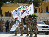 Military training exercises during the graduation ceremony of the Major General Mohammed Al-Faris course in Afrin countryside, northwest Syr...