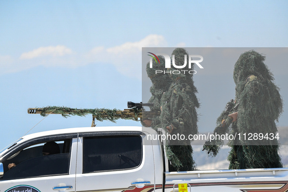 Military training exercises during the graduation ceremony of the Major General Mohammed Al-Faris course in Afrin countryside, northwest Syr...