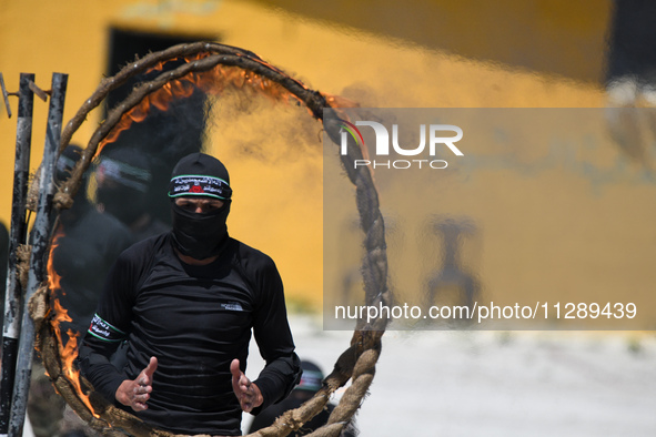 Military training exercises during the graduation ceremony of the Major General Mohammed Al-Faris course in Afrin countryside, northwest Syr...