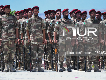 Military training exercises during the graduation ceremony of the Major General Mohammed Al-Faris course in Afrin countryside, northwest Syr...