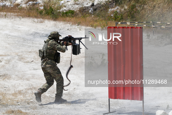 Military training exercises during the graduation ceremony of the Major General Mohammed Al-Faris course in Afrin countryside, northwest Syr...