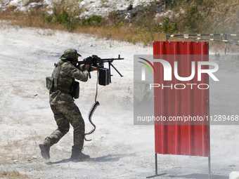 Military training exercises during the graduation ceremony of the Major General Mohammed Al-Faris course in Afrin countryside, northwest Syr...