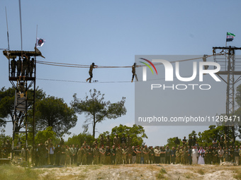 Military training exercises during the graduation ceremony of the Major General Mohammed Al-Faris course in Afrin countryside, northwest Syr...