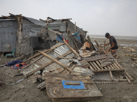 Men are repairing their damaged shop after Cyclone Remal's landfall in Patuakhali, Bangladesh, on May 29, 2024. Cyclone Remal, which made la...