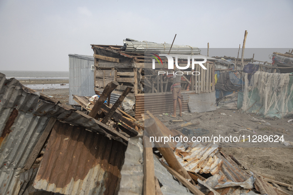 Men are repairing their damaged shop after Cyclone Remal's landfall in Patuakhali, Bangladesh, on May 29, 2024. Cyclone Remal, which made la...