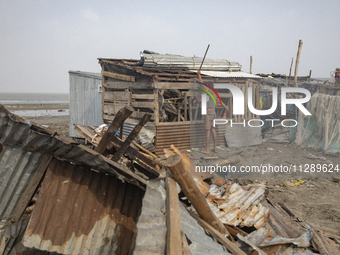 Men are repairing their damaged shop after Cyclone Remal's landfall in Patuakhali, Bangladesh, on May 29, 2024. Cyclone Remal, which made la...