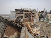 Men are repairing their damaged shop after Cyclone Remal's landfall in Patuakhali, Bangladesh, on May 29, 2024. Cyclone Remal, which made la...