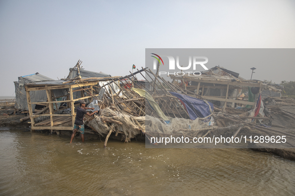 Men are repairing their damaged shop after Cyclone Remal's landfall in Patuakhali, Bangladesh, on May 29, 2024. Cyclone Remal, which made la...