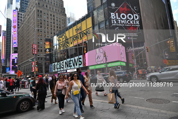 People are walking in Times Square where the machete stabbing is taking place. The New York City Police Department is saying that at approxi...