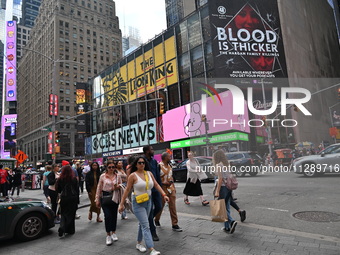 People are walking in Times Square where the machete stabbing is taking place. The New York City Police Department is saying that at approxi...