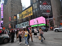 People are walking in Times Square where the machete stabbing is taking place. The New York City Police Department is saying that at approxi...