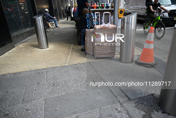 People are walking in Times Square where the machete stabbing is taking place. The New York City Police Department is saying that at approxi...